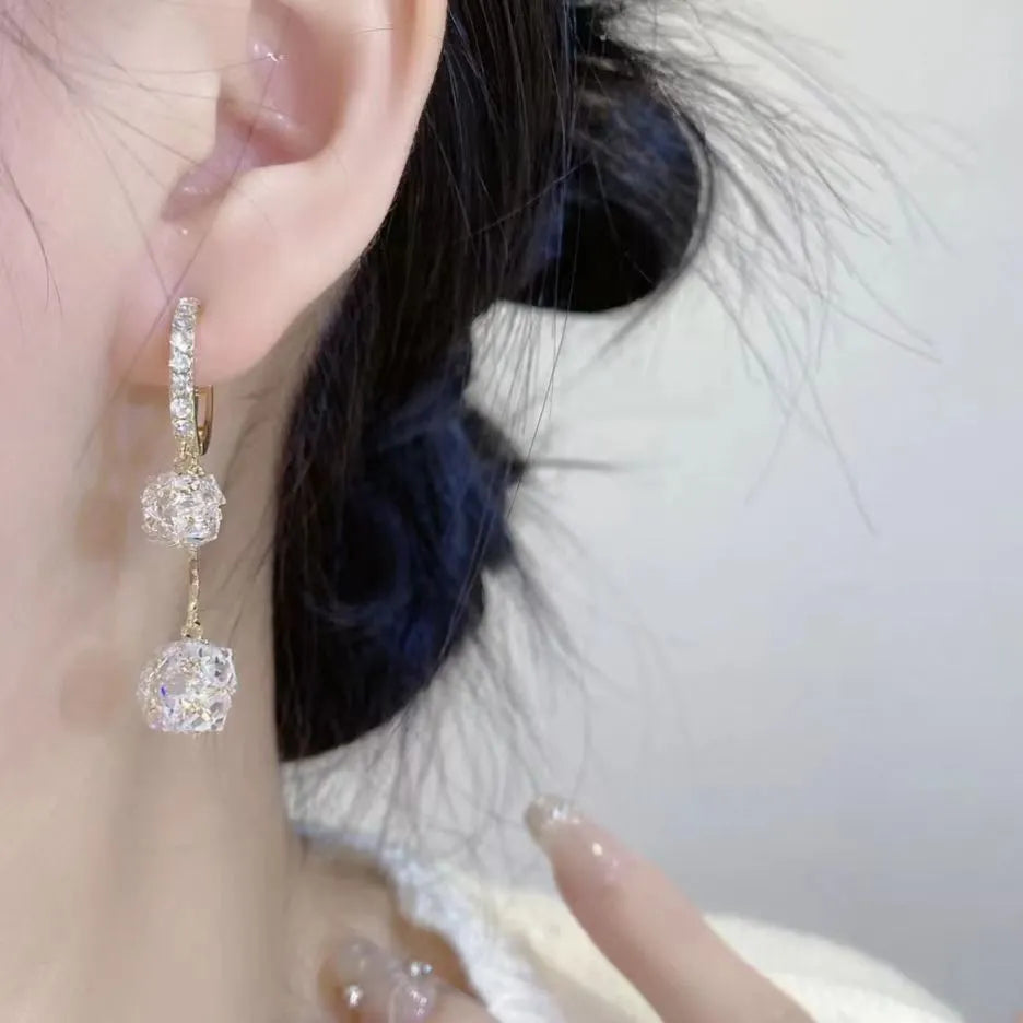 Silver drop shape women's earrings with rhinestone ball and tassel pendant designs