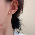 Women's fishtail design earrings with electroplated finish in white gold or yellow gold colour