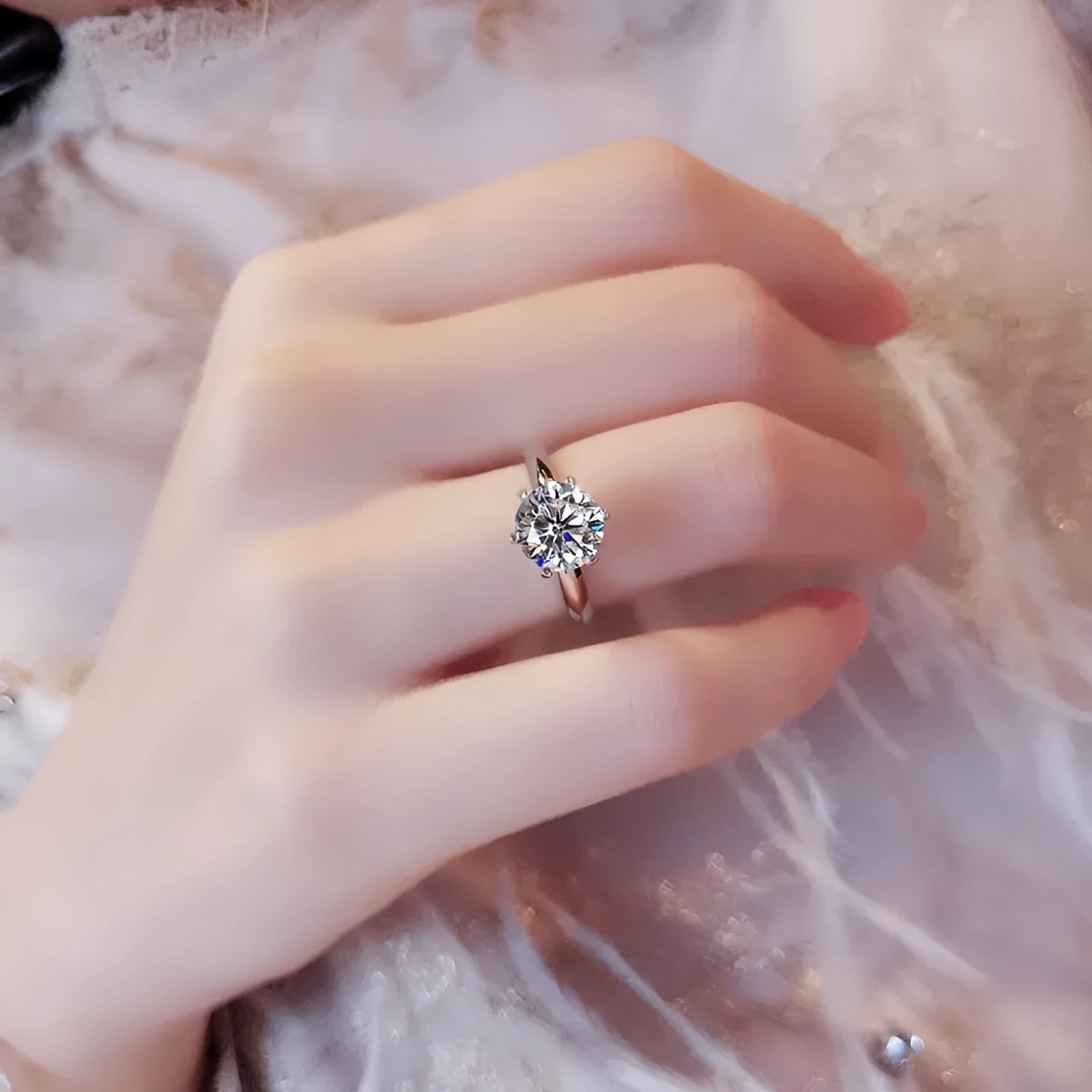 White gold plated geometric ring with a six-claw setting holding a zircon stone.