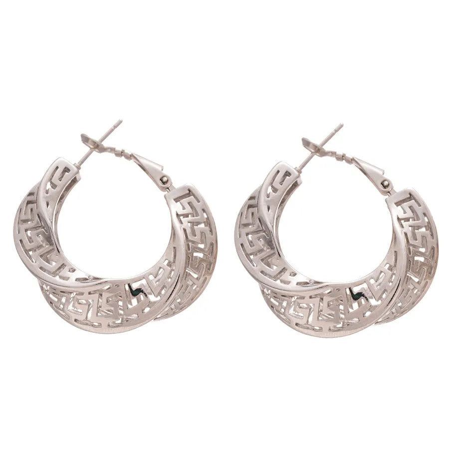 Women's geometric hollow stud earrings with exaggerated twisted round shape and electroplated silver finish