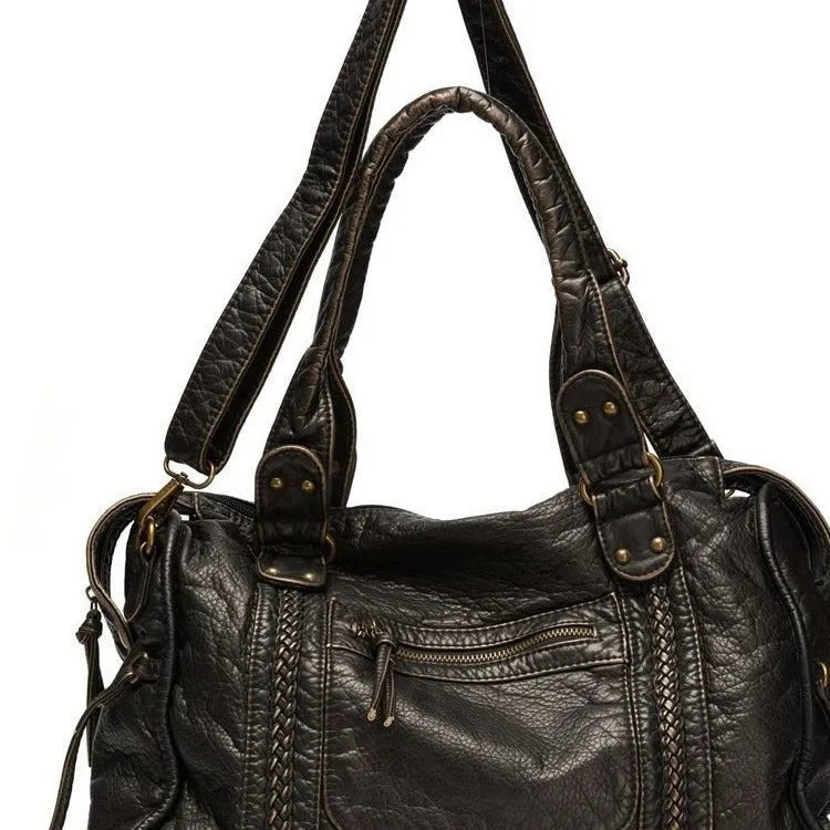 Women's French retro motorcycle style messenger shoulder bag in soft PU leather with woven detailing