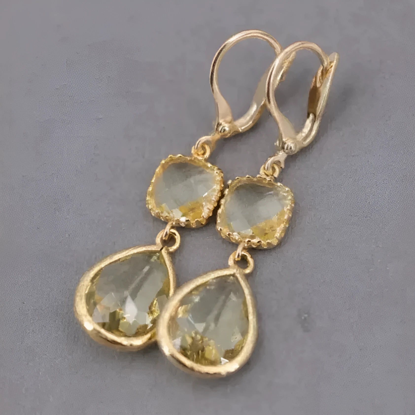 Gold geometric long fringe earrings with water droplet crystals on copper with electroplated finish