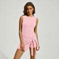 Women's solid colour sports skirt tennis suit with back shaping design on a mannequin.