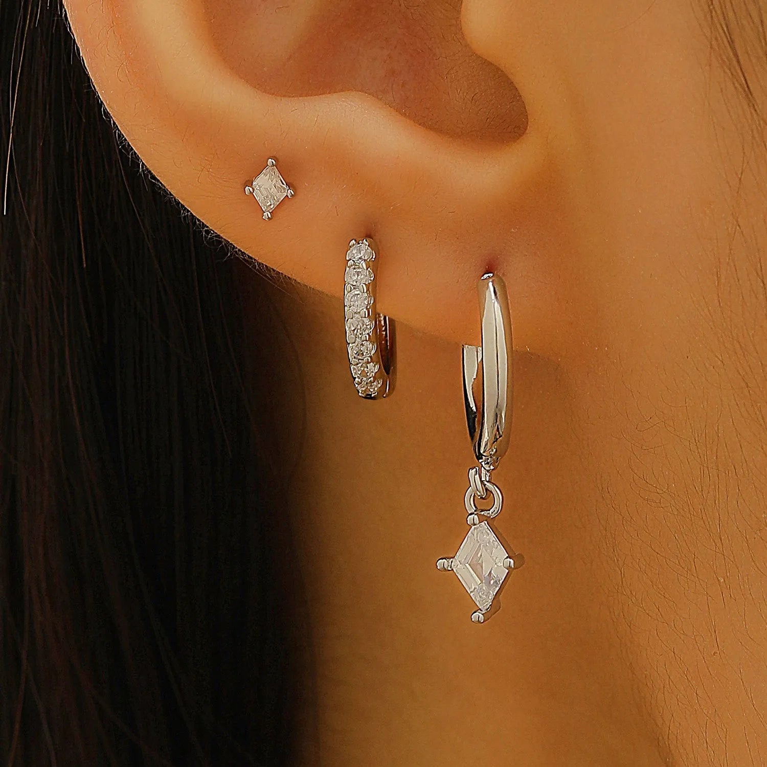 Geometric zircon earring three-piece set showing ear rings, stud earrings, and ear clasps with rhombus patterns