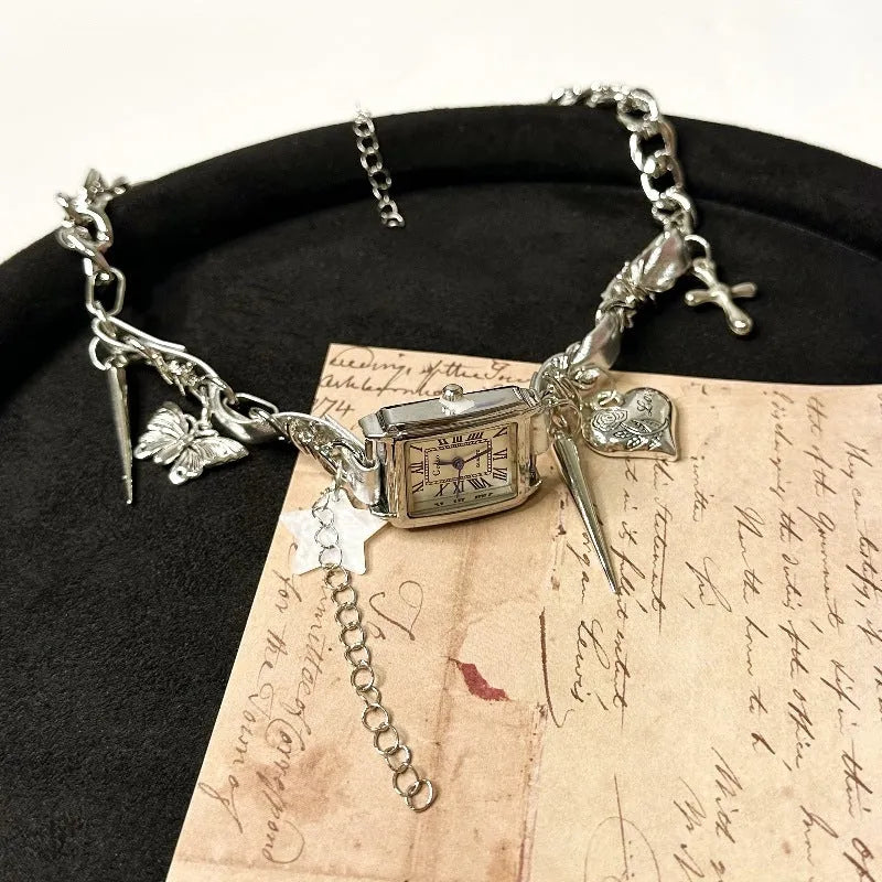 Dark style women's multi-layer cross necklace with twin clavicle chains showing large hemp flower links