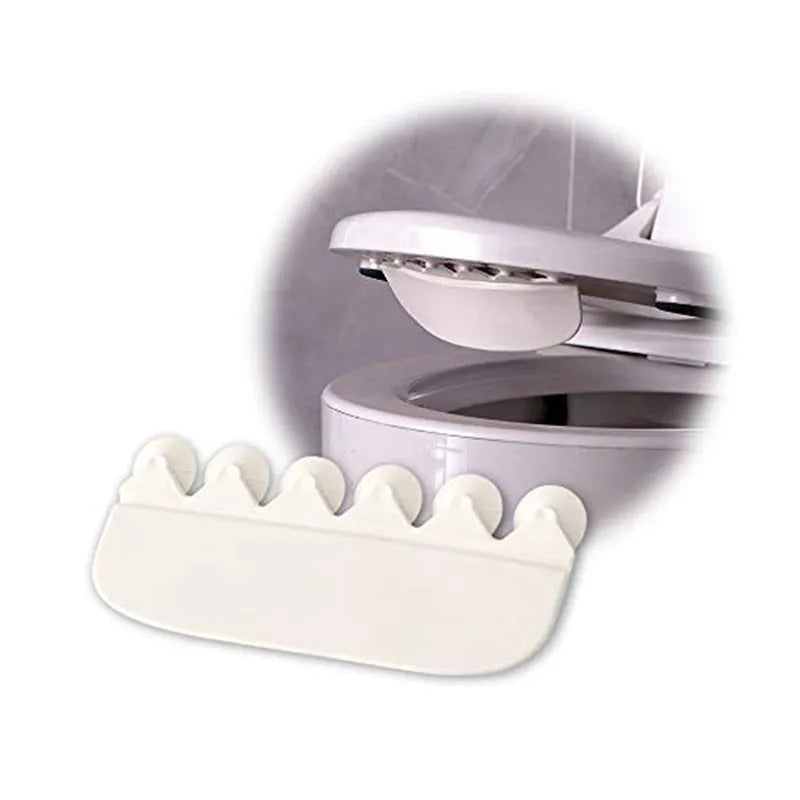 White PVC toilet urine blocking board placed on standard toilet seat