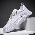 Men's low-top skateboard shoes with elastic band, microfiber upper, and rubber sole in black or white.