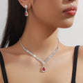 Claw chain rhinestone jewellery set with water drop shapes in a choice of colours, showing necklace, earrings, and optional bracelet.