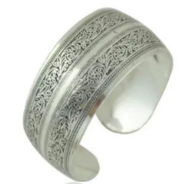 Open carved alloy bracelet with ethnic Miao-inspired patterns in adjustable design