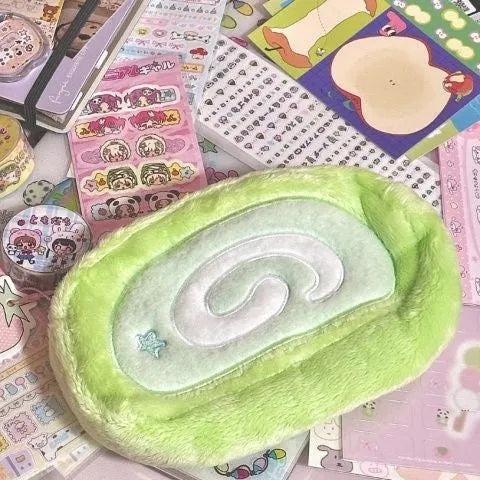 Honeydew coloured velvet pencil case with a Swiss roll cake design print.