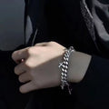 Men's titanium steel bracelet with geometric cross design on wrist