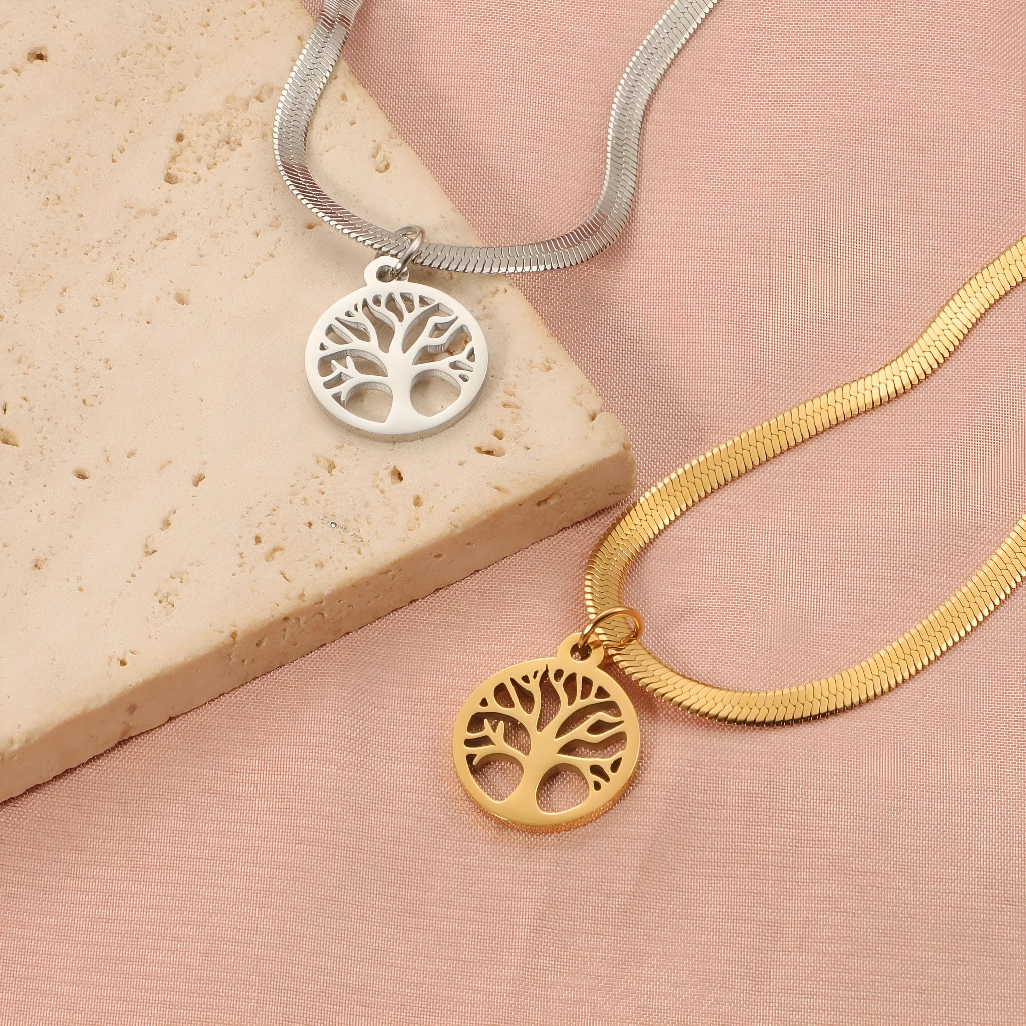 Stainless steel necklace with a U-shaped tree pendant on a snake bones chain.