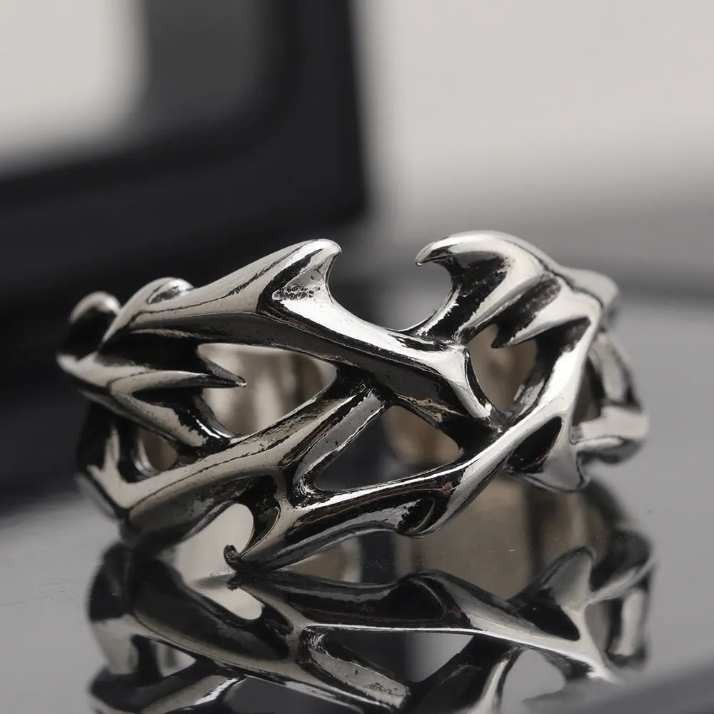 Copper geometric ring with thorn and flower design featuring adjustable opening