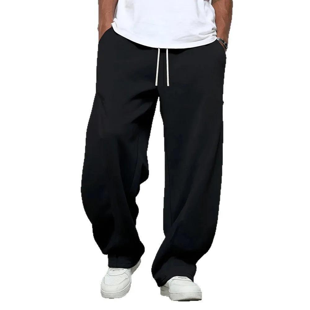 Men's straight-leg casual polyester trousers in black, shown with a drawstring waist.