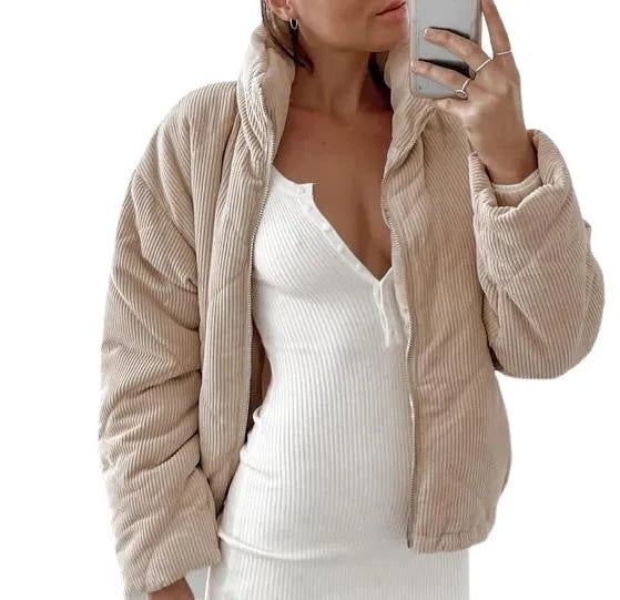 Women's apricot corduroy jacket with stand collar and front zip, showing textured fabric detail