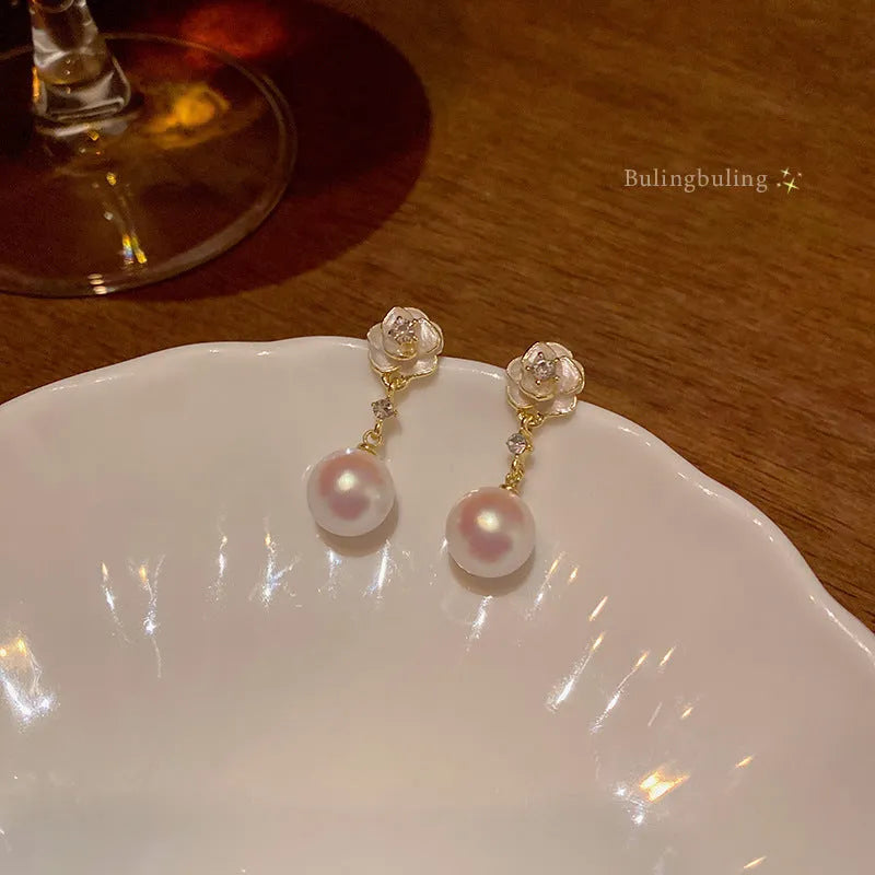 Camellia flower stud earrings for women in alloy metal with floral design