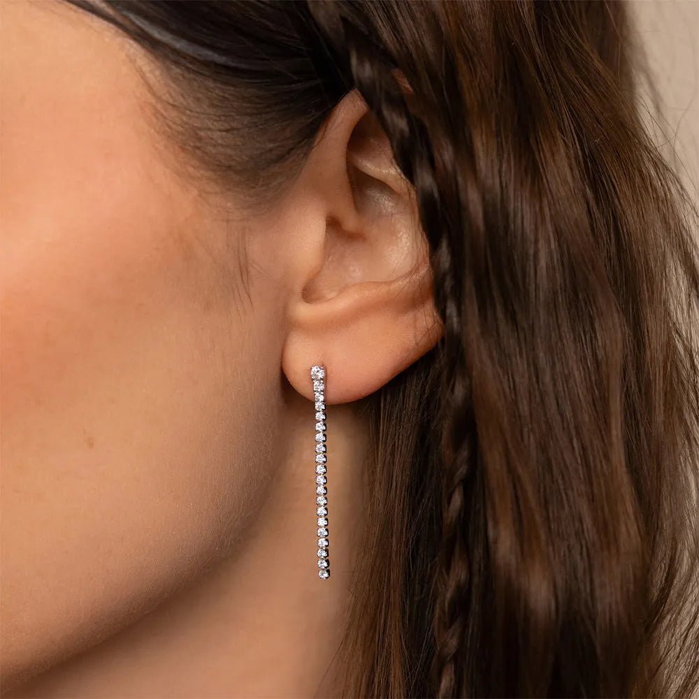 Gold and steel tone geometric women's earrings with zircon stones and line detail in Chinese style.