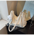 Women's soft PU fashion backpack with pendant accessory in beige, black, blue, and silver colour options