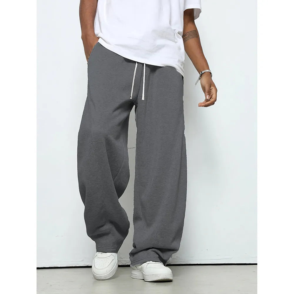 Men's straight-leg casual polyester trousers in black, shown with a drawstring waist.