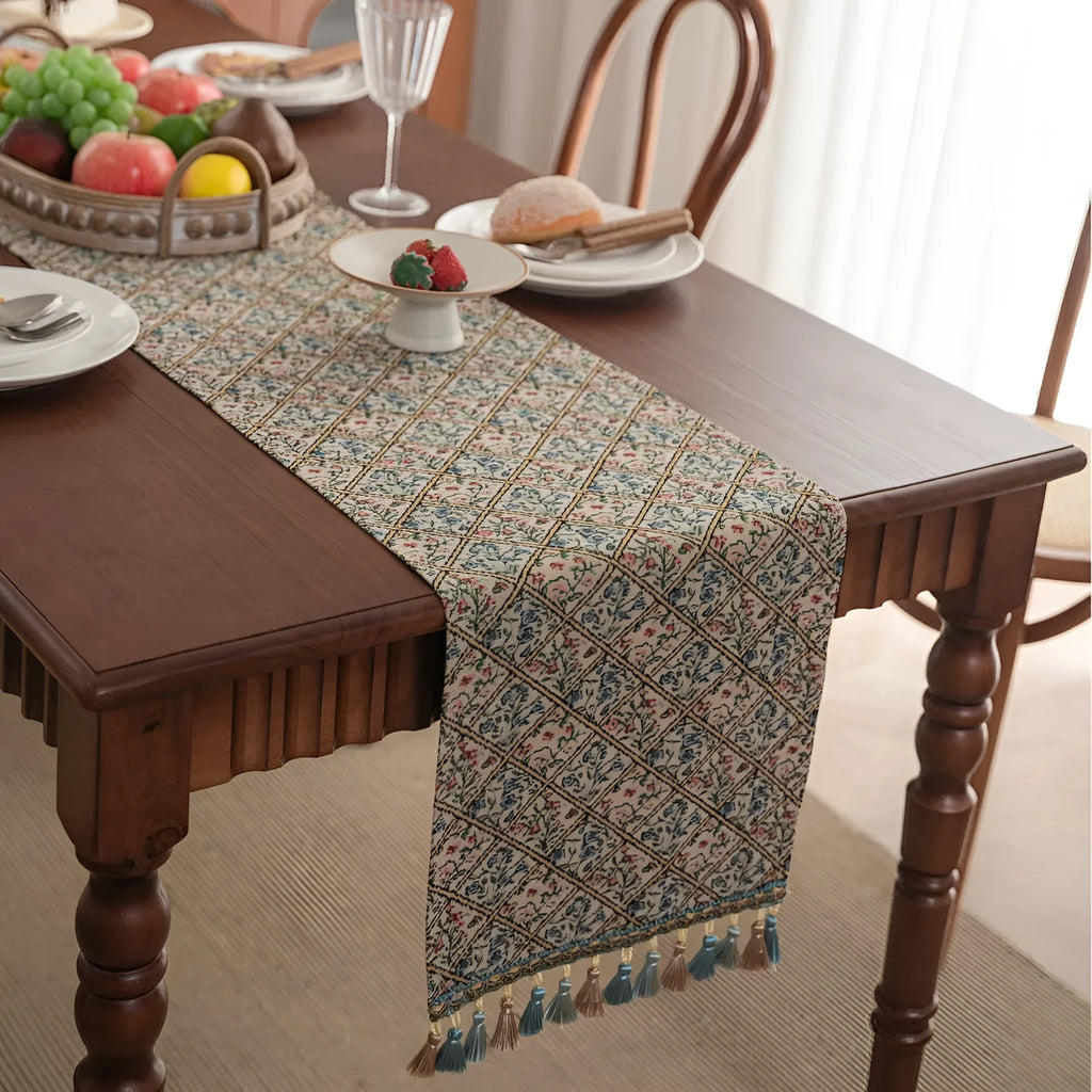 Nordic jacquard table runner with tassel trim in dark blue stripe pattern on wooden table
