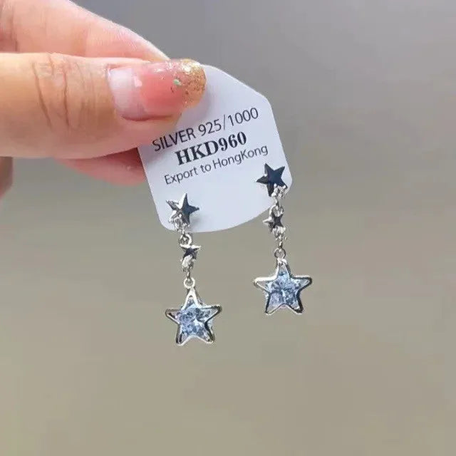 Women's geometric silver-tone alloy earrings with rhinestone star charms and tassel drops