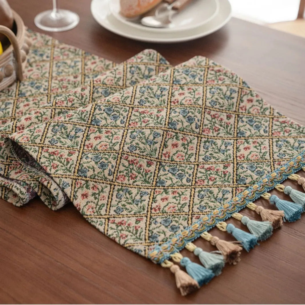 Nordic jacquard table runner with tassel trim in dark blue stripe pattern on wooden table