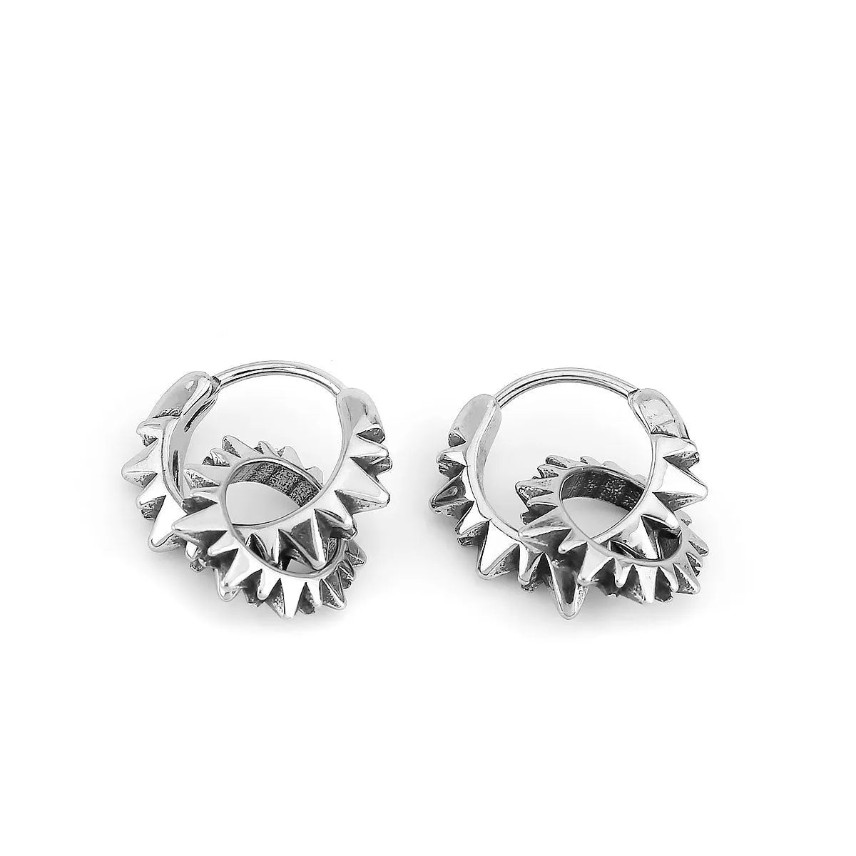 Stainless steel retro round ring earrings with polished steel finish on model