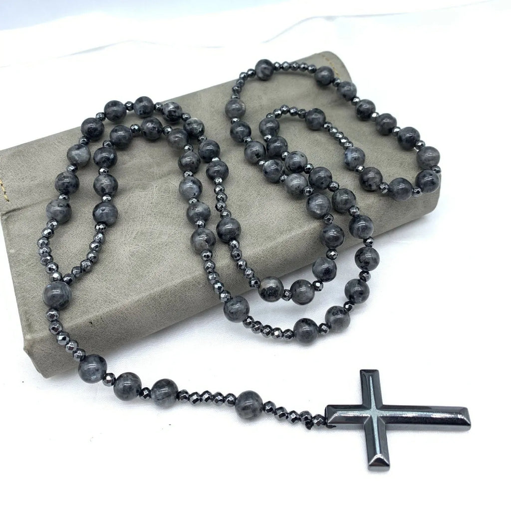 Men's stone necklace with a geometric cross pendant on a ball bead chain, showing the safety lock clasp.
