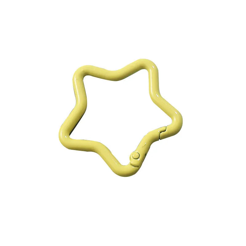Zinc alloy five-pointed star keychain charm in assorted colours on a key ring.