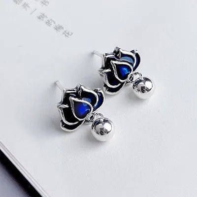 Blue lotus earrings with retro seedpod tassels measuring 1.2cm wide