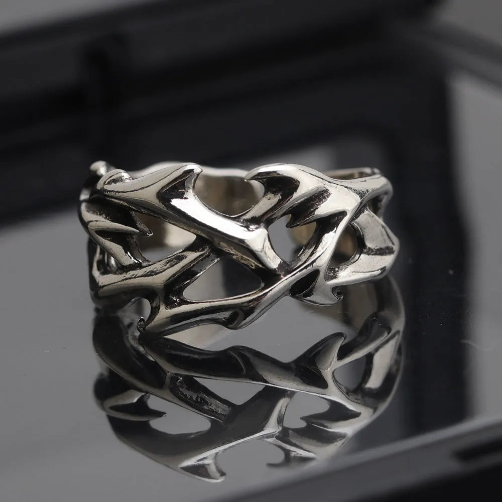 Copper geometric ring with thorn and flower design featuring adjustable opening