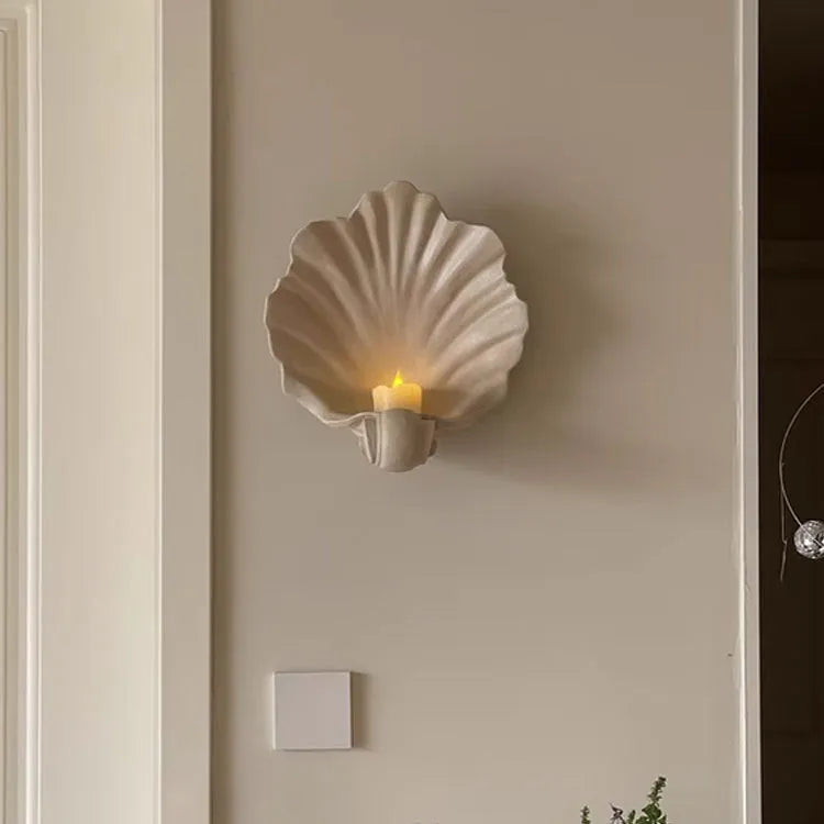 White resin decorative shell ornament for use as a fruit plate or table centrepiece.