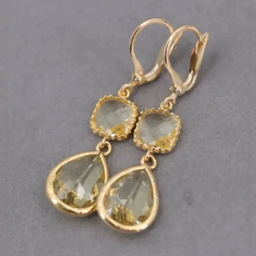 Gold geometric long fringe earrings with water droplet crystals on copper with electroplated finish