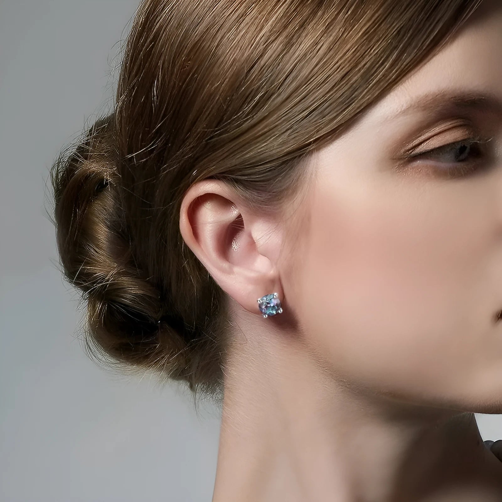 925 sterling silver ear studs with round cultivated Alexandrite stone in geometric setting.