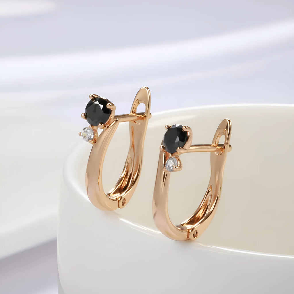 Women's gold geometric drop earrings with black agate stone effect and retro styling