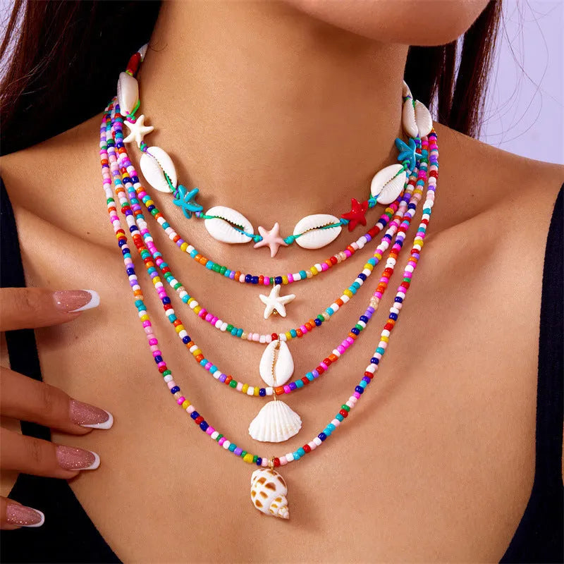 Women's multi-layer necklace set with starfish and shell pendants in blue and assorted colours