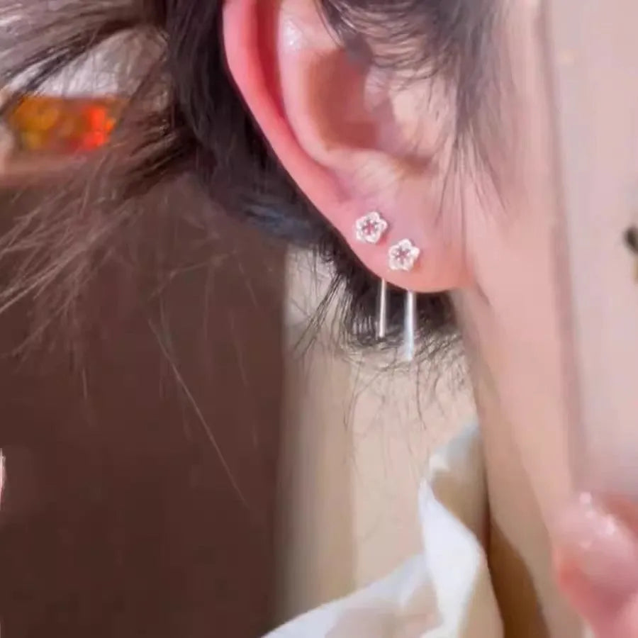 Silver colour hollow flower drop earrings with natural petal design and dangling length
