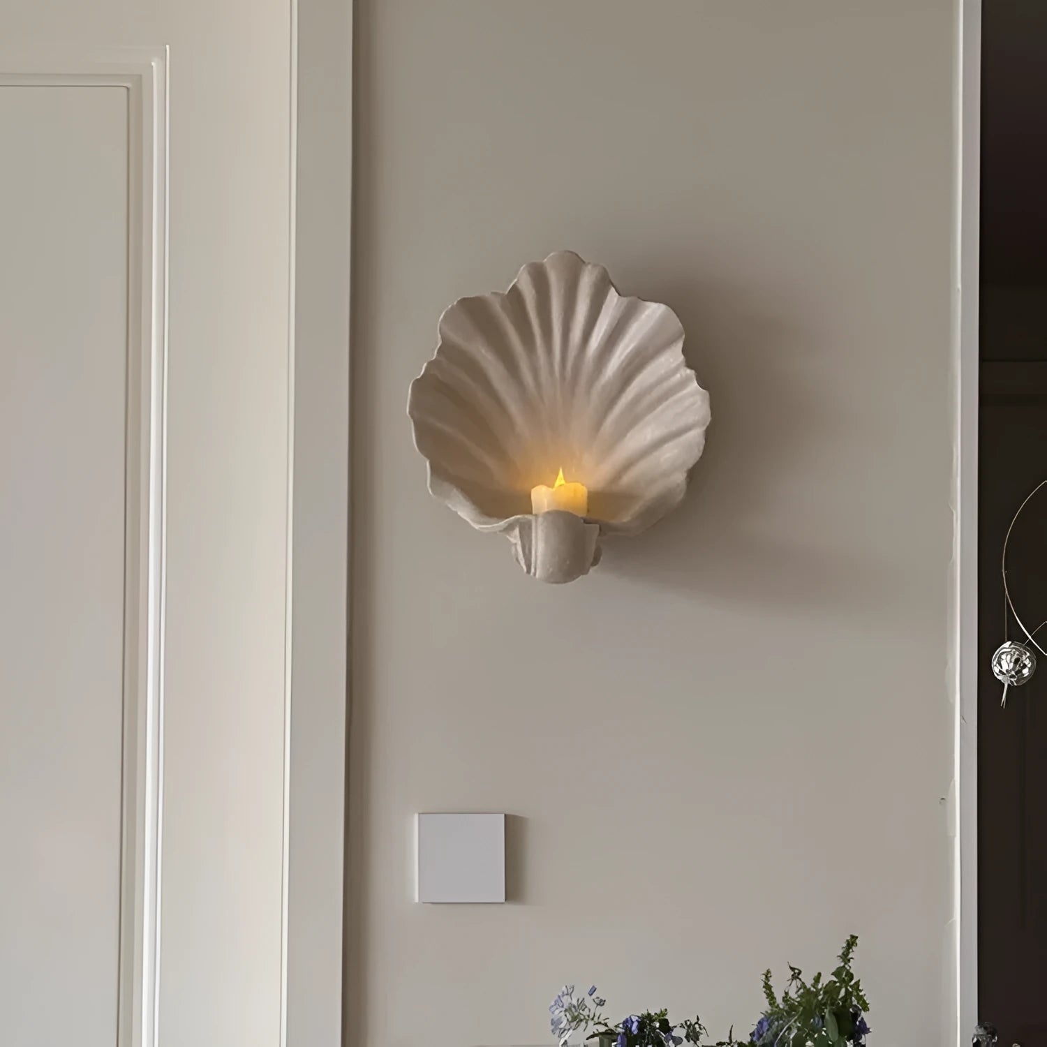 White resin decorative shell ornament for use as a fruit plate or table centrepiece.