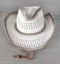Brown leather velvet Western cowboy hat with a curved brim on a wooden post.