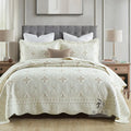European style embroidered pure cotton bed cover set with two pillowcases on a bed
