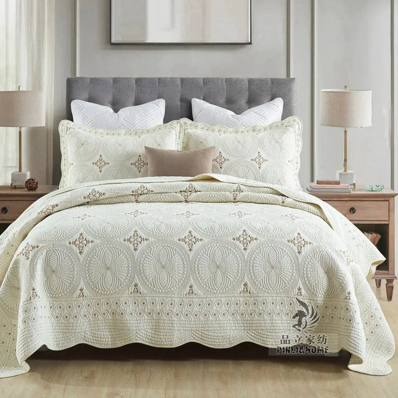European style embroidered pure cotton bed cover set with two pillowcases on a bed