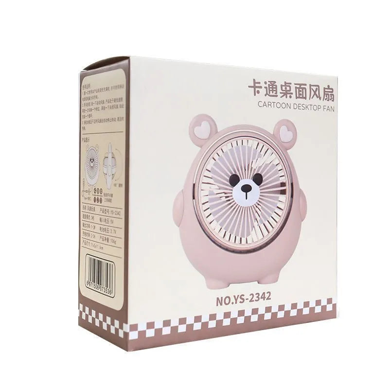 Dog-themed plastic USB desktop fan in Apricot Puppy colour on a wooden desk.