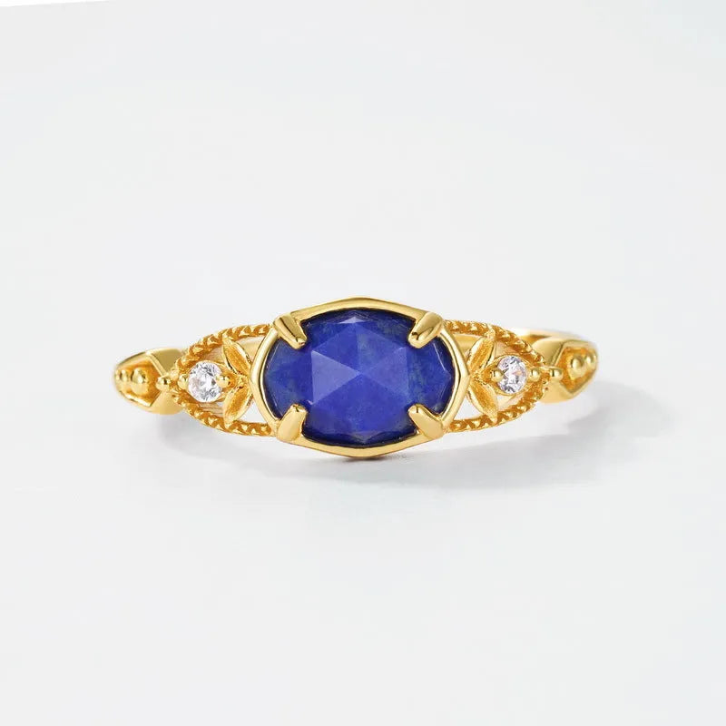 Silver alloy geometric ellipse ring with a deep blue lapis lazuli stone, Japanese style.