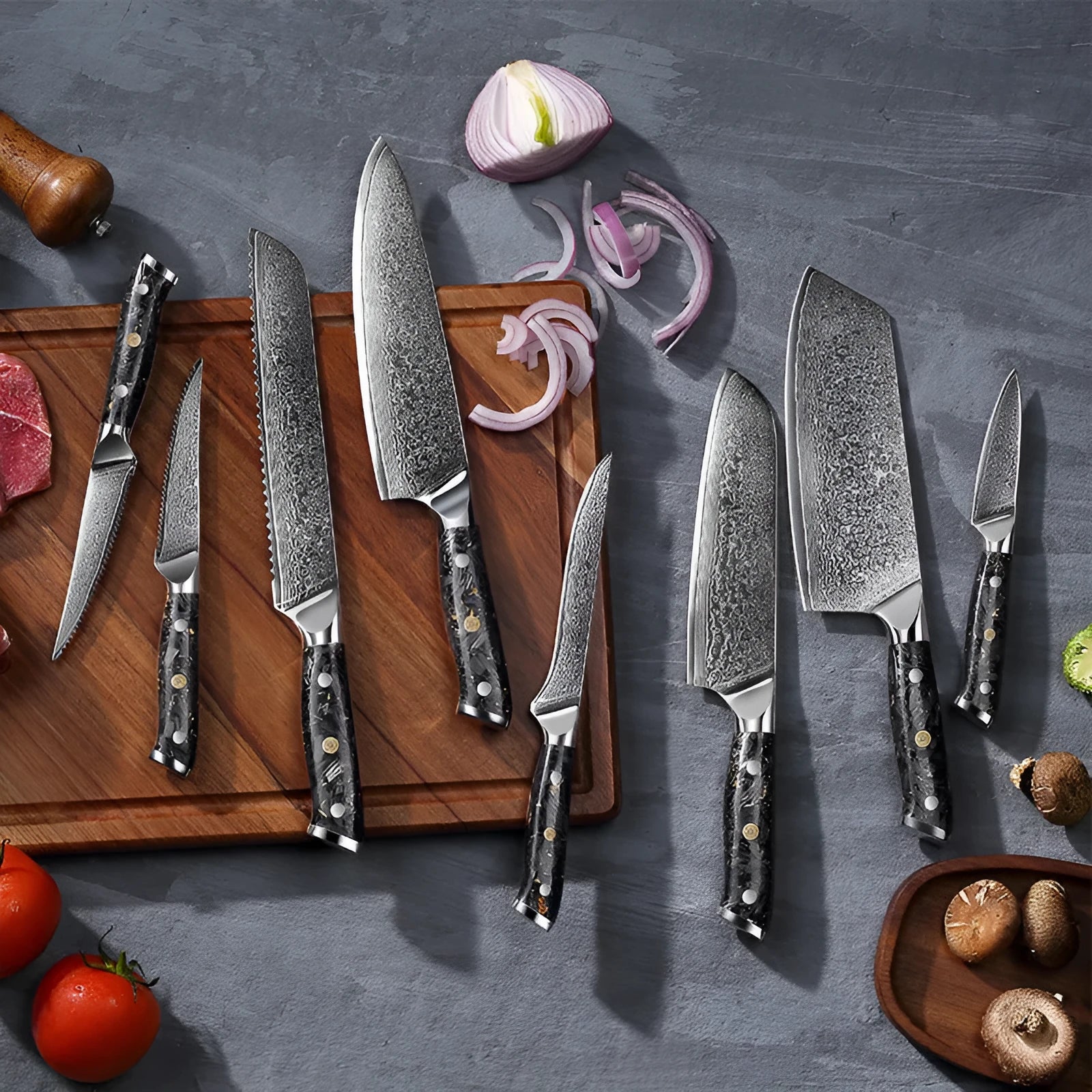 Damascus steel kitchen knife set with eight blades including Japanese and boning knives on a wooden surface
