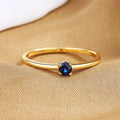 Simple geometric copper ring with a single round diamond, shown in blue, green, red, and white colour options.