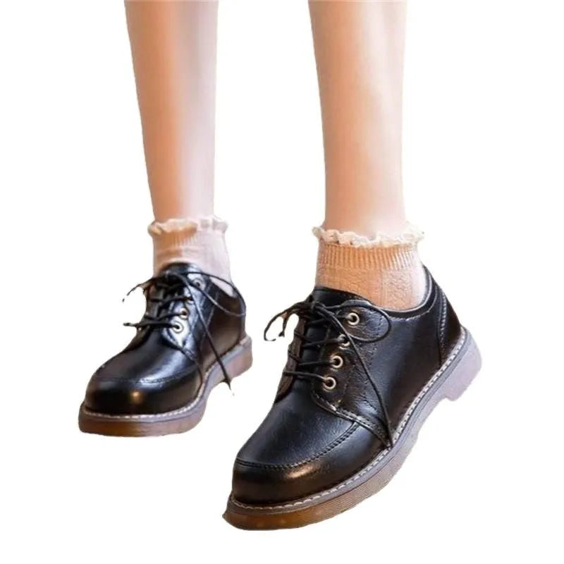 Women's black preppy retro Mary Jane pumps with low square heel and front lace-up.