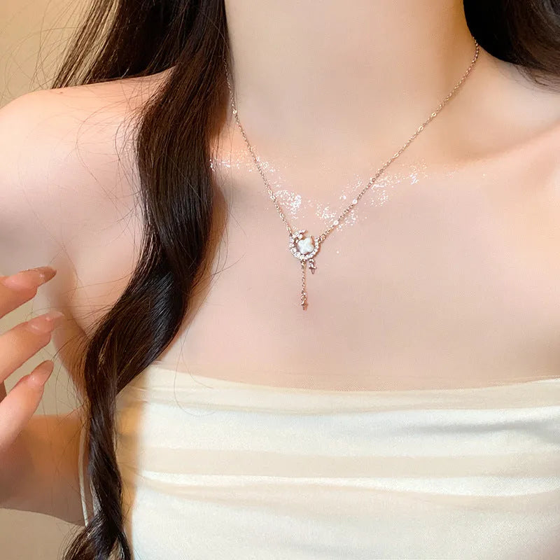 Gold and silver star moon necklace with zirconium diamonds on adjustable clavicle chain