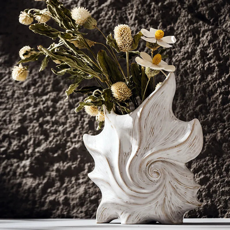 French art style ceramic vase with coloured glaze finish on a table