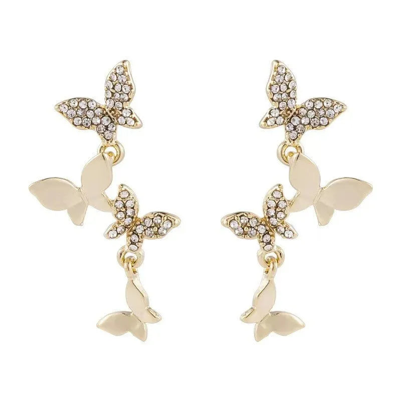 Gold colour copper butterfly drop earrings with four butterfly design elements