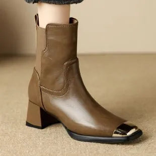 Brown high-heel Martin ankle boots with side zip and metal decoration on cowhide leather.